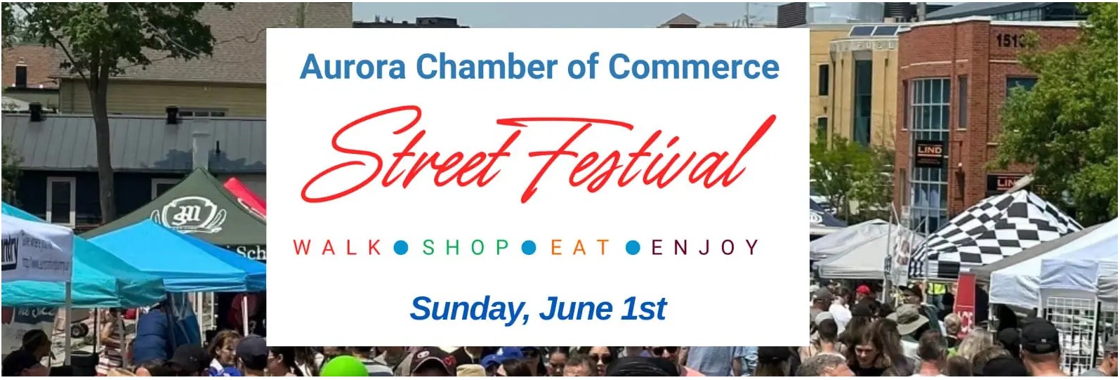Street festival banner and crowded street scene