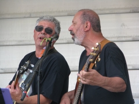 Burke and Peter playing banjo, guitar and singing
