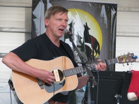 Eric playing guitar and singing