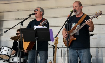 Burke and Peter playing banjo, guitar and singing