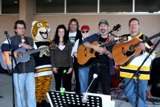 Band posing on stage - Mark,tiger mascot,unknown,Jim DeVries,Paul Snelgrove,Peter,Eric