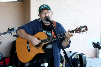 Peter playing guitar and singing
