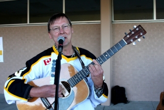 Eric playing guitar and singing