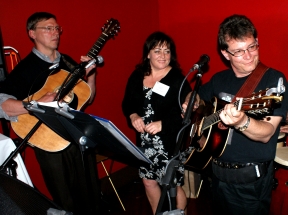 Eric and Mark with guitars and a PR lady