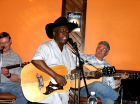 Albert singing and playing guitar,Eric and Burke backup guitar
