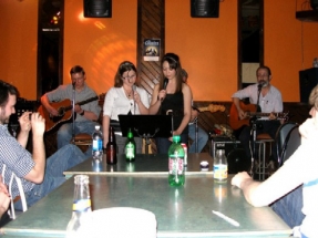 Amalee and Stephanie singing with Eric and Peter playing guitar