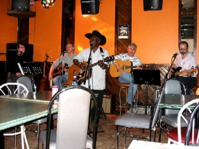 Albert singing and playing guitar, with Coyotes backup