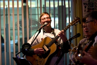 Smiling Eric on guitar and singing