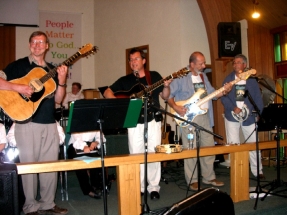 Smiling Eric on guitar,Mark singing & guitar,Peter bass, Burke tambourine